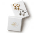 Gold and silver He Lives earrings with Divine Designs gift box