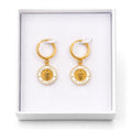 Gold and white He Lives earrings in gift box
