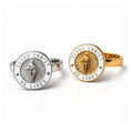 Silver and gold Jesus Christ He Lives rings side by side